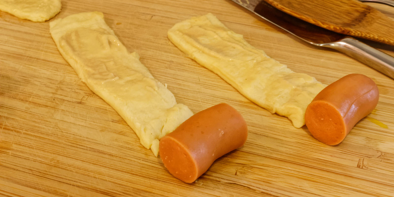 Sausage cut the same size as the width of the dough stripe