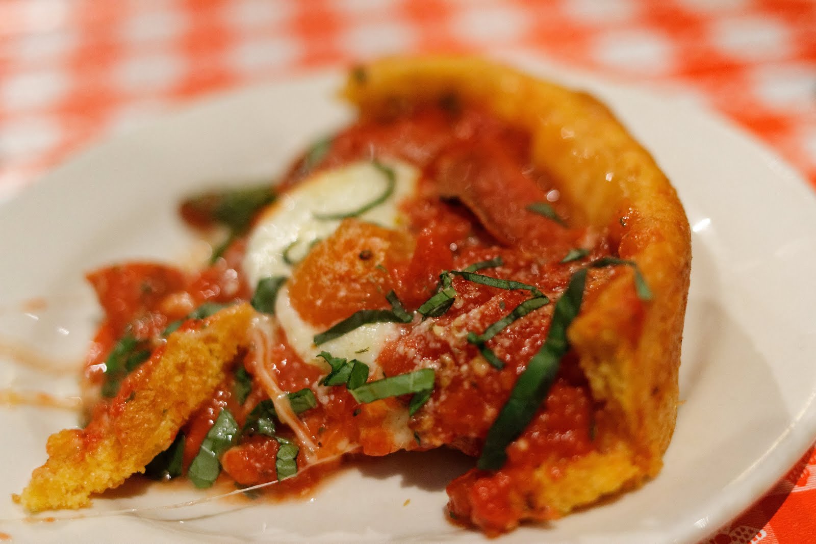 Spinach Mozzarella pizza with extra garlic and pepperoni at Gino's East (162 E Superior St, Chicago, IL 60611).